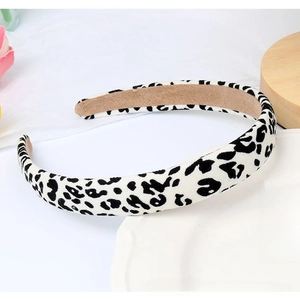 Close-up of black and white leopard print headband with non-slip suede inner lining