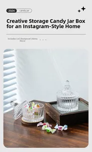 Detailed view of striped glass candy jars with pointed lids on a wooden surface