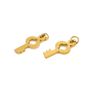 Macro detail of golden key charms, one plain and one engraved with LOVE in stainless steel