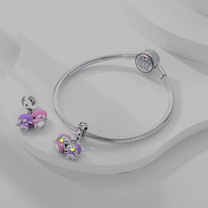Close-up of 925 sterling silver charm bracelet featuring Family Forever engraving and charms