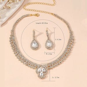 Detail view of gold rhinestone jewelry set with precise chain and earring dimensions
