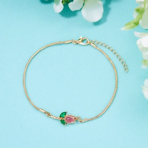 Close-up of golden tulip bracelet with pink gemstone petals and adjustable lobster clasp