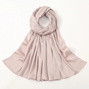 Elegant pale pink silk-satin hijab scarf with smooth texture and delicate glossy finish