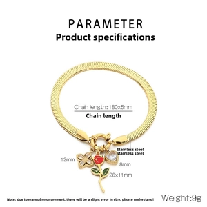 Detail view of gold stainless steel snake chain bracelet with heart and rose charms