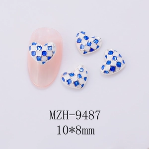 Macro detail of 10x8mm blue checkerboard heart nail charms with silver alloy edges