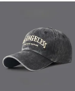 Macro shot of 3D embroidery detail on vintage washed cotton baseball cap fabric