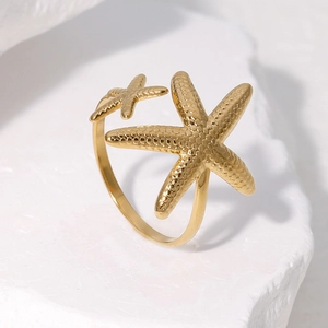 Golden starfish open ring in stainless steel with ocean theme and textured metal finish