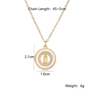 Macro detail of 18K gold plated cross pendant necklace with mother of pearl and zircon