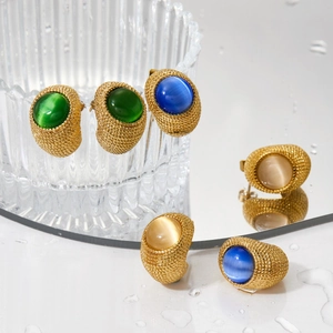 Cat eye stone earrings in green, blue and champagne colors with gold woven texture