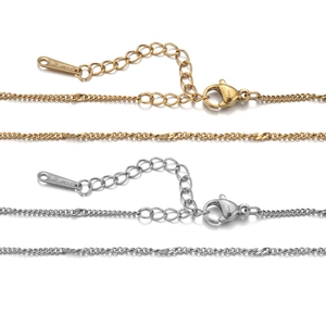 Polished gold and silver stainless steel flat sequin chains with lobster clasp and S-STEEL tag