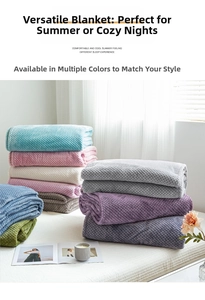Close-up of soft flannel blankets in multiple colors with waffle texture on bed