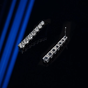 Elegant moissanite tassel drop earrings in silver finish with eight round-cut stones