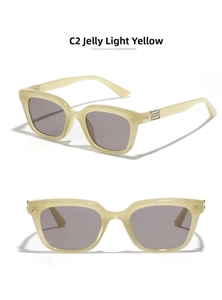 Detail view of vintage cat-eye sunglasses in jelly yellow frame with grey lenses