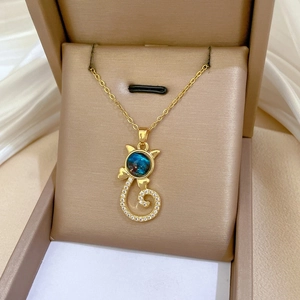 Close-up of titanium steel cat pendant with blue star stone in a luxury jewelry box