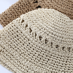 Detailed view of the woven texture and natural straw fibers in cream and light brown