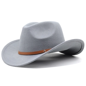 Detail of light grey wool cowboy hat with brown leather band and silver buckle