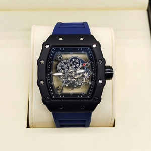 Detail of tonneau-shaped skeleton watch with blue rubber strap in a luxury gift box