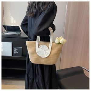 Detail of contrast cotton rope tote bag with white round handles and tulip decoration