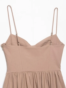 Detail of khaki midi dress featuring thin adjustable straps and a side invisible zipper