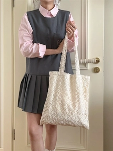 Elegant white floral lace tote bag for women shown in a soft indoor setting