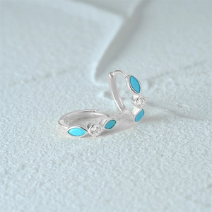 Macro view of S925 silver hoop earrings with marquise turquoise and round crystal stones