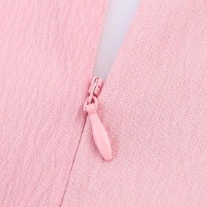 Pink V-neck dress back view with high-quality invisible zipper and textured fabric detail