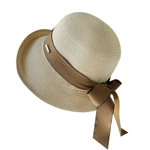 Chapeau de soleil élégant pour femme avec grand nœud et tissage en paille