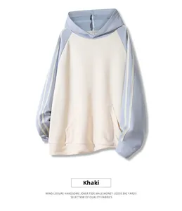 Detail of khaki casual hoodie with blue raglan sleeves and white side stripes