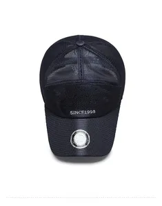 Detail of dark blue breathable mesh baseball cap with silver sticker and embroidery
