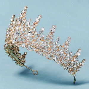 Detailed side view of luxury bridal crown with purple crystals and sparkling rhinestones