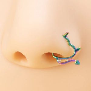 Rainbow plated iridescent demon tail septum ring shown on professional silicone nose model