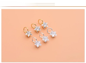 Detailed view of 925 sterling silver star pendants with sparkling cubic zirconia stones