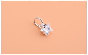 Macro shot of 925 sterling silver mini star pendant with clear zircon for jewelry making
