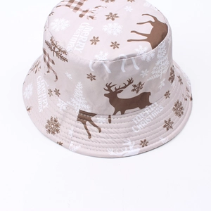 Detail of Christmas bucket hat with reindeer pattern and Merry Christmas text print