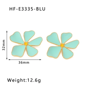 Detail view of light blue enamel flower earrings with dimensions 36mm by 32mm