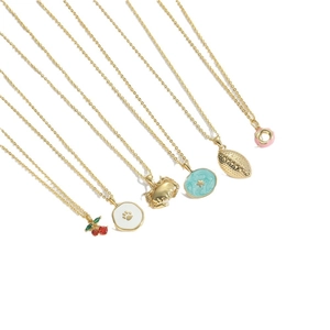 Set of six gold necklaces featuring ocean crab, cherry, and celestial enamel pendants