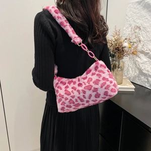 Pink leopard print faux fur shoulder bag worn by model showing texture and trendy size