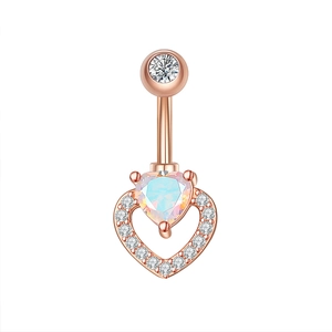 Detailed macro view of heart-shaped opal belly ring with zircon in rose gold plating