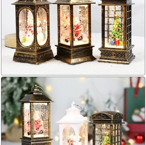 Close-up of a vintage bronze snow globe lantern with LED light and snowman interior