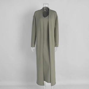 Detail of grey-green knitted long cardigan and matching maxi dress on mannequin