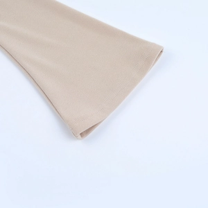 Detailed close-up of knit cuffs with precise double stitching on apricot mini dress