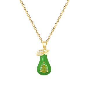 Elegant gold-tone necklace with green pear pendant and leaf design on white background