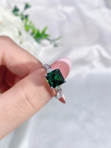 Close-up of luxury S925 sterling silver ring with a large square emerald gemstone