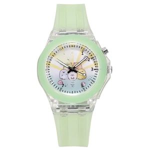 Macro shot of colorful unicorn quartz watch with mint green strap and clear plastic case