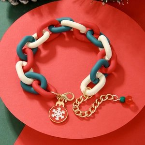 Close-up of Christmas link bracelet with red, green, white beads and snowflake charm