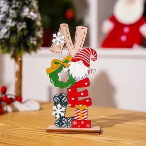 Close-up of wooden NOEL letter sign with Christmas gnome design on a wooden table