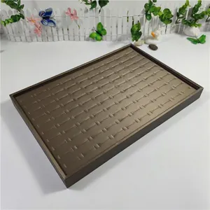 Detailed top view of a large capacity 100-slot jewelry display tray for rings and studs
