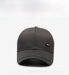 Front view of grey cotton twill baseball cap showing sport badge detail and curved brim