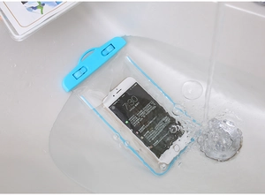 Light blue waterproof phone pouch being tested under running water showing reliable seal