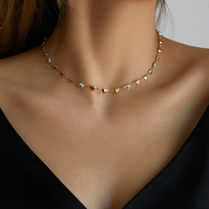 Modern 18K gold plated brass choker featuring evil eye beads and heart shaped metal links